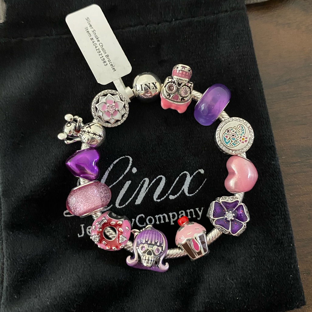 Linx Snake Chain Bracelet With Girly Skull Themed Charms
